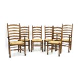 A set of six 18th century style oak ladder back dining chairs,