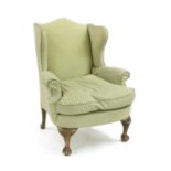 A George I style wing armchair,