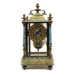 A late 19th century champleve enamel and green onyx mantel clock,