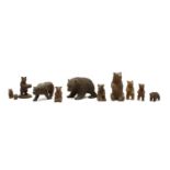 A collection of ten small Black Forest and other carved wooden bears,