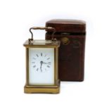 An Edwardian cased timepiece carriage clock