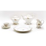 A 19th century gilt and white tea set,