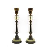 An unusual pair of bronze onyx and glass table lamps