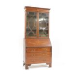 An Edwardian mahogany and inlaid bureau bookcase,