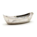 An oval boat shaped silver bread dish