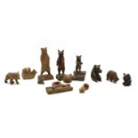 A collection of eleven carved wooden Black Forest and other bears,