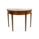 A George III mahogany and boxwood strung demi lune tea table,