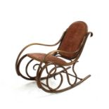 A late 19th century Thonet stained beech rocking chair,