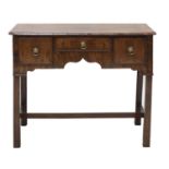 An 18th century walnut lowboy,