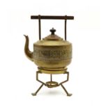 An Aesthetic brass kettle on stand,