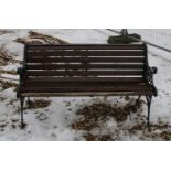 A Victorian design cast iron and teak garden bench,
