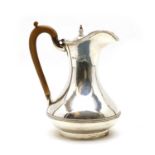 A modern silver hot water jug