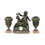 A large spelter clock garniture