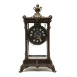 A cast four glass mantel clock,