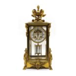 A late 19th century ormolu glass mounted mantel clock,