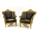 A pair of gilt armchairs,