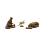 A bronze of a girl rolling dice,