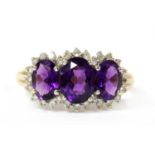 A 9ct gold amethyst and diamond triple cluster ring,