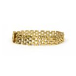 A 9ct gold three row faceted panther link bracelet,