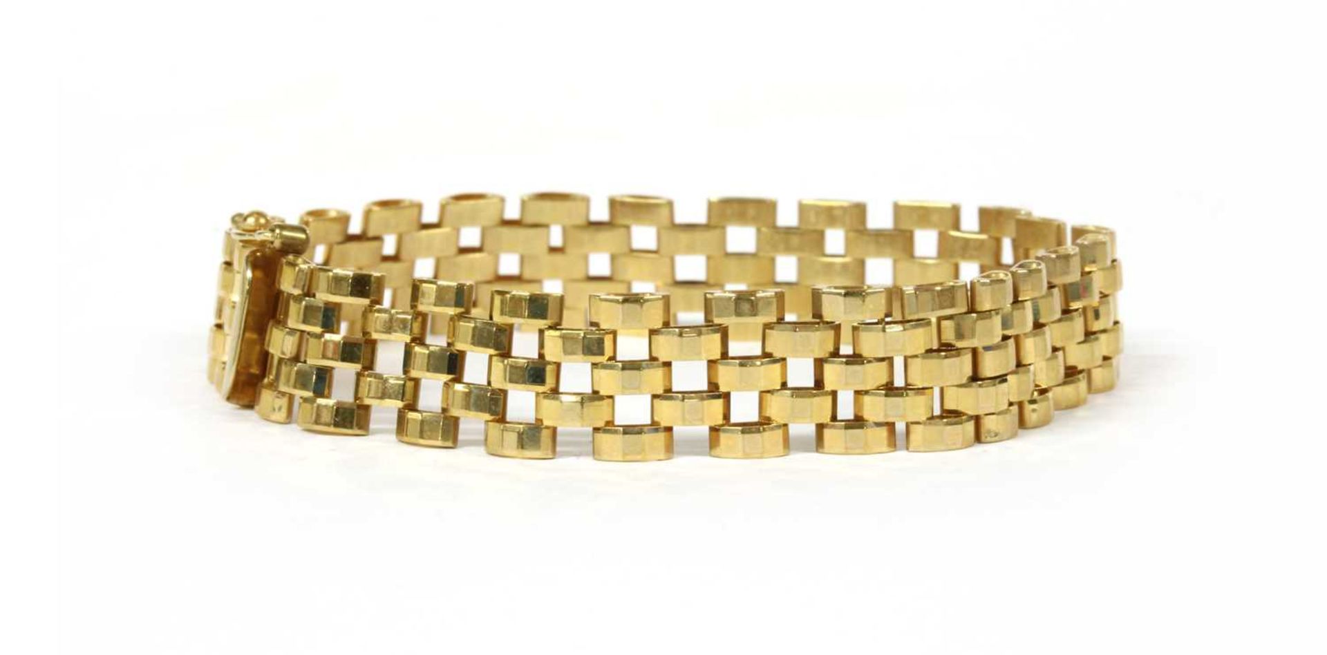 A 9ct gold three row faceted panther link bracelet,