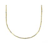 An 18ct yellow and white gold necklace,