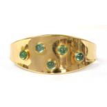 A gold gem-set torque bangle,