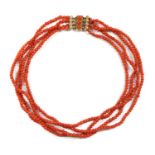 A four row uniform coral bead necklace,