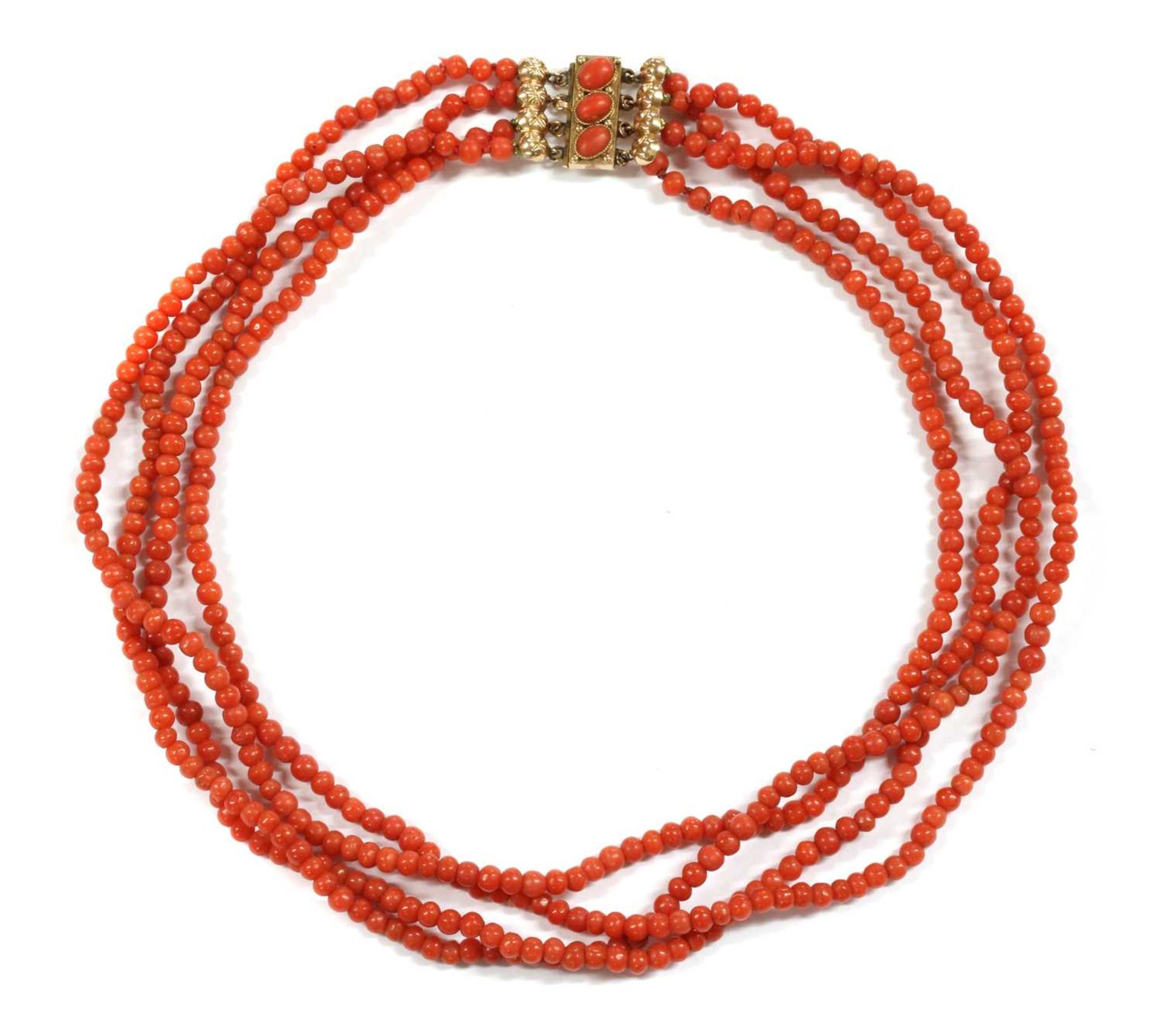 A four row uniform coral bead necklace,