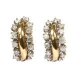 A pair of 9ct gold diamond set half hoop earrings,