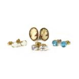 A quantity of gold gem-set stud earrings,