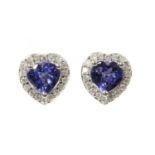 A pair of white gold tanzanite and diamond halo cluster earrings,