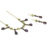 A gold and silver, peridot, amethyst and diamond fringe necklace,