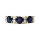 A gold eleven stone sapphire and diamond ring,