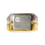 A gentlemen's 18ct two colour gold diamond set ring,