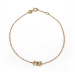 An 18ct gold diamond bow bracelet,