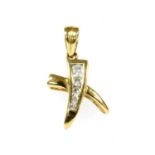 An 18ct gold diamond set 'kiss' pendant or charm,