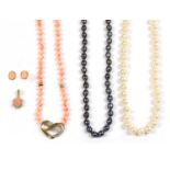 A single row uniform coral bead necklace,