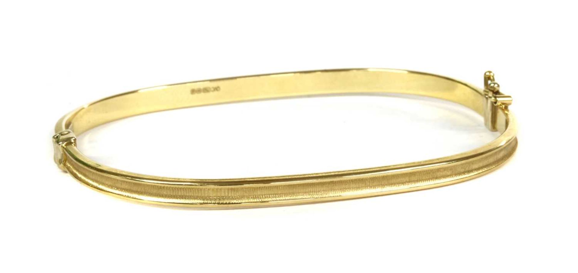 An 18ct gold hollow hinged bangle,