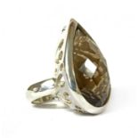 A large silver single stone smoky quartz ring,
