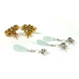 A pair of gold single stone pearl earrings,