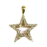 A gold diamond set star pendant,