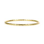 An 18ct gold hollow twisted wire bangle,