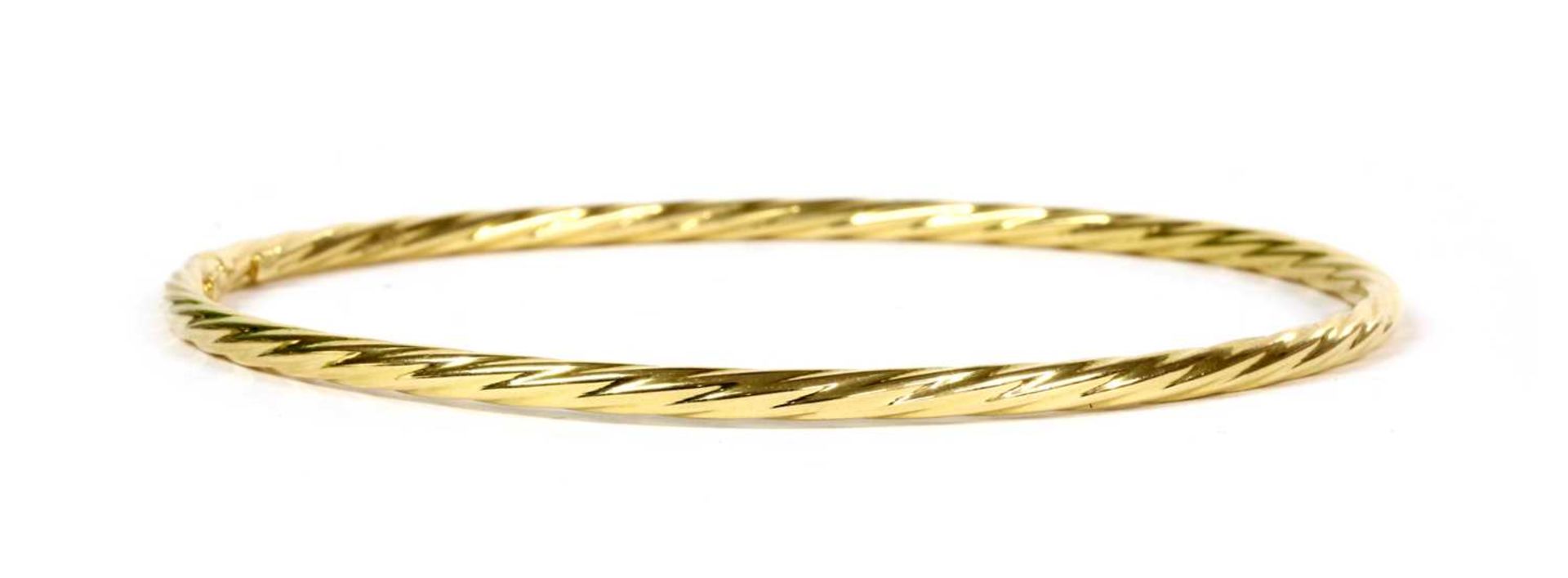An 18ct gold hollow twisted wire bangle,