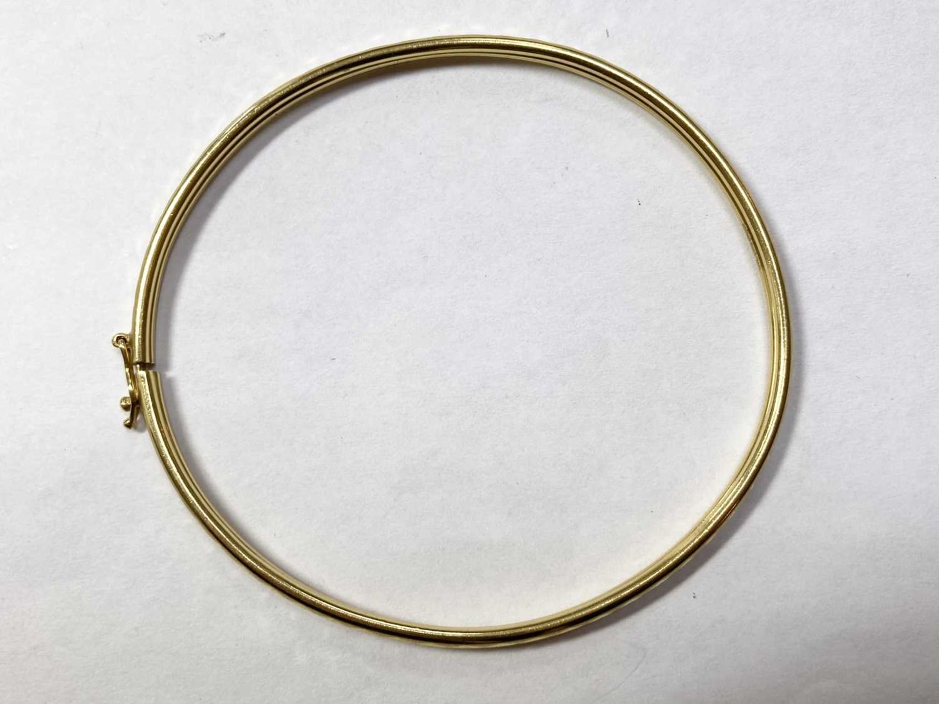 A 22ct gold oval bangle, - Image 2 of 3
