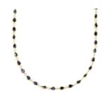 A gold sapphire rivière necklace,