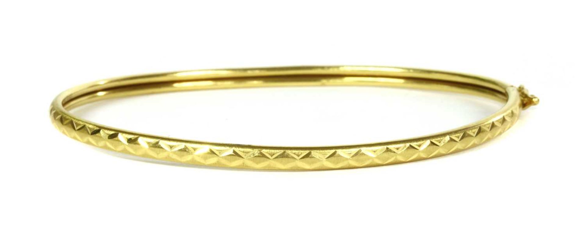 A 22ct gold oval bangle,