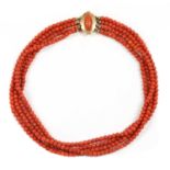 A Dutch four row uniform coral bead necklace,