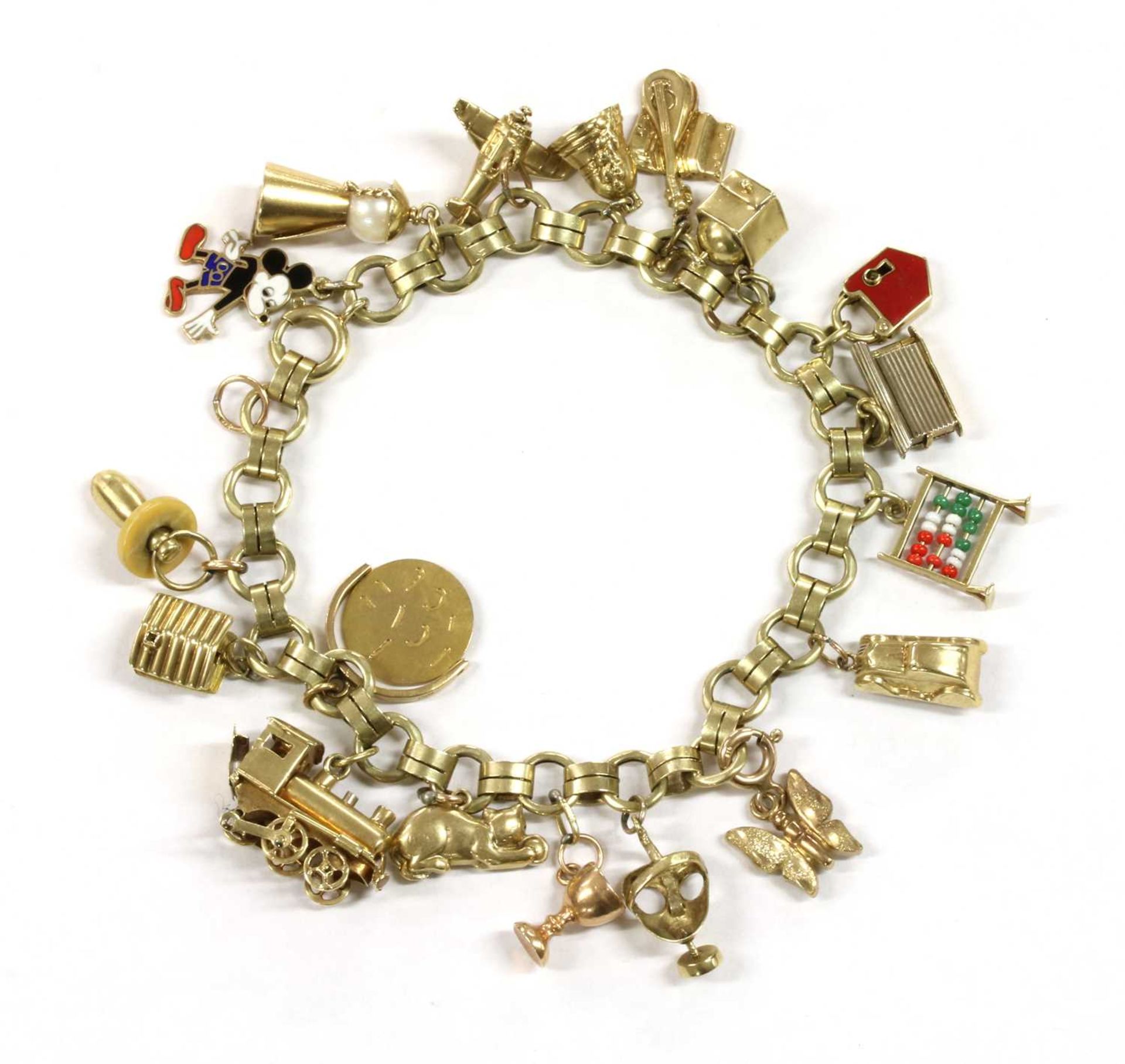 A Continental gold charm bracelet,