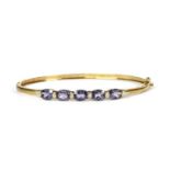 A 9ct gold iolite and diamond bangle,