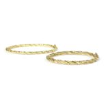 A 14ct gold oval hollow twisted wire bangle,